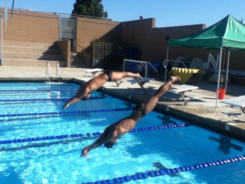 Students diving into the campus pool Yo Han (back) & Michael Moran (front) Photo by: Lea Brannon