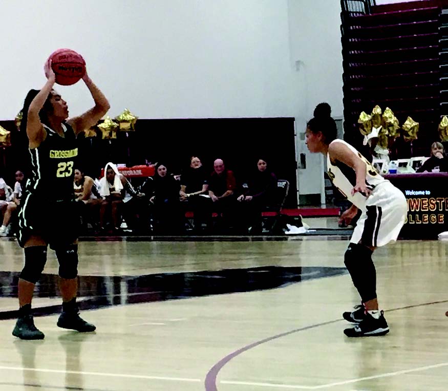 Versatile Athlete Drew Mendoza
looks for an open teammate
in the last basketball game of the season
against Southwestern College.